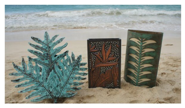 Verdigris copper palm frond, hammered copper art panel, and green patina cylinder sconce on the beach