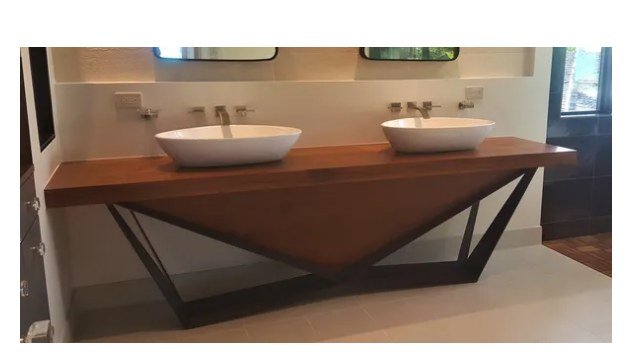 Custom metal-framed double vanity with vessel sinks and teak countertop
