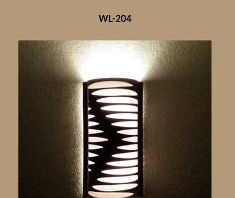 Wall sconce WL-204 lit, wave cutout pattern glowing on wall